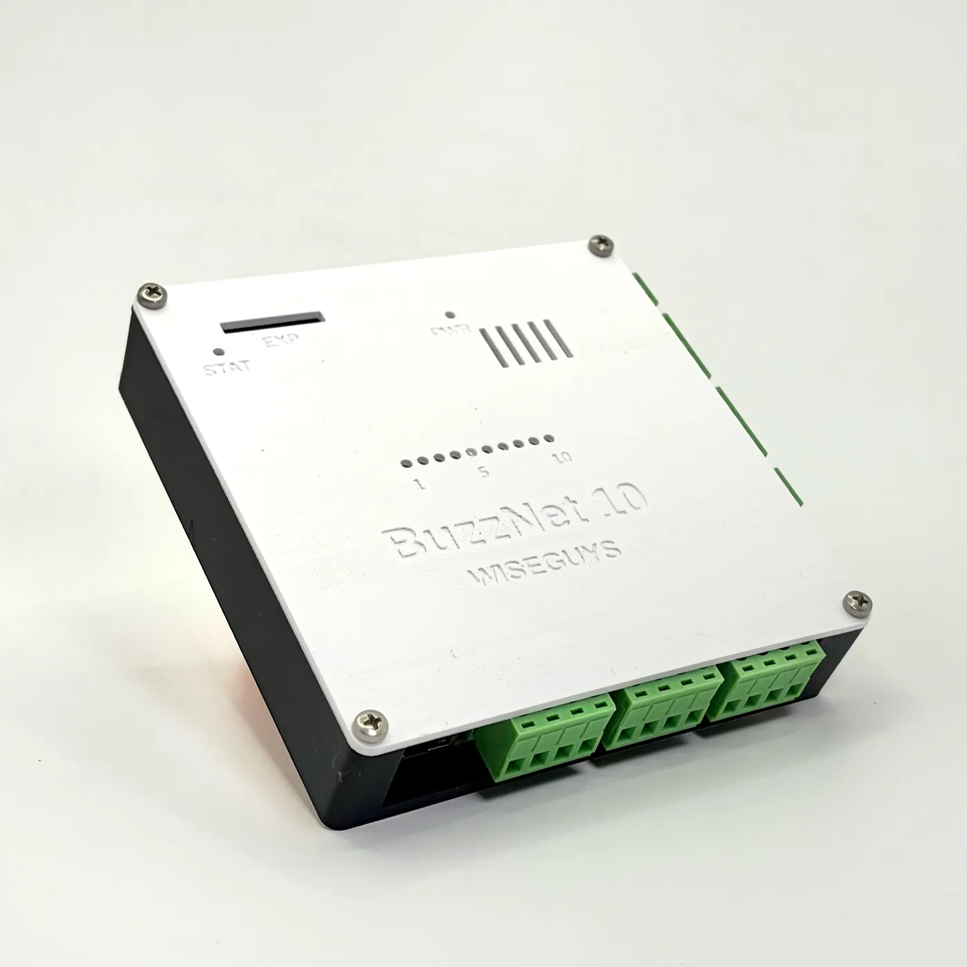 BuzzNet 10 in its enclosure: white lid with the BuzzNet 10 and WiseGuys lettering, ten input LED windows and green button terminals along the side